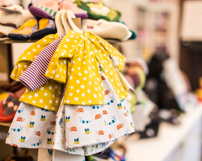Children's dresses on a rack at a local shop